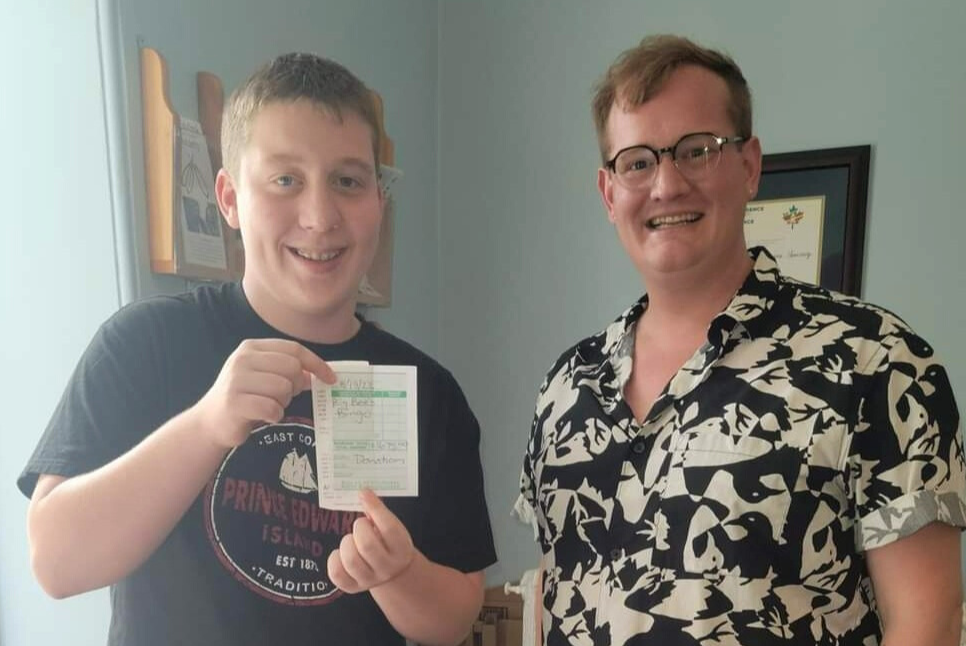 Gwen's son Kyle drops off a donation to Autism Nova Scotia.